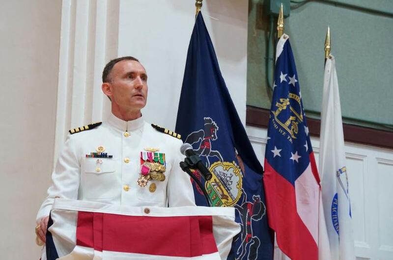 Capt. Rich Jarrett, outgoing commander of Yokosuka Naval Base, Japan, speaks during his change-of-command ceremony at the base theater, Friday, July 8, 2022.