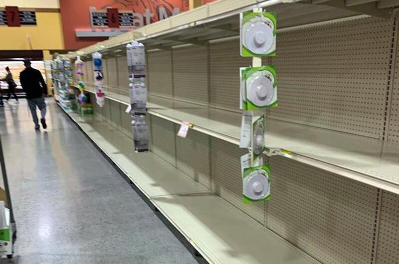 Commissary shelves that usually hold toilet paper are empty at Marine Corps Air Station Iwakuni, Japan, Sunday, March 1, 2020.