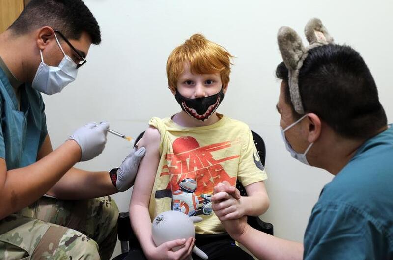 Will Henjum, 7, is the first to receive the Pfizer-BioNTech pediatric COVID-19 vaccine at Camp Humphreys, South Korea, Nov. 17, 2021.