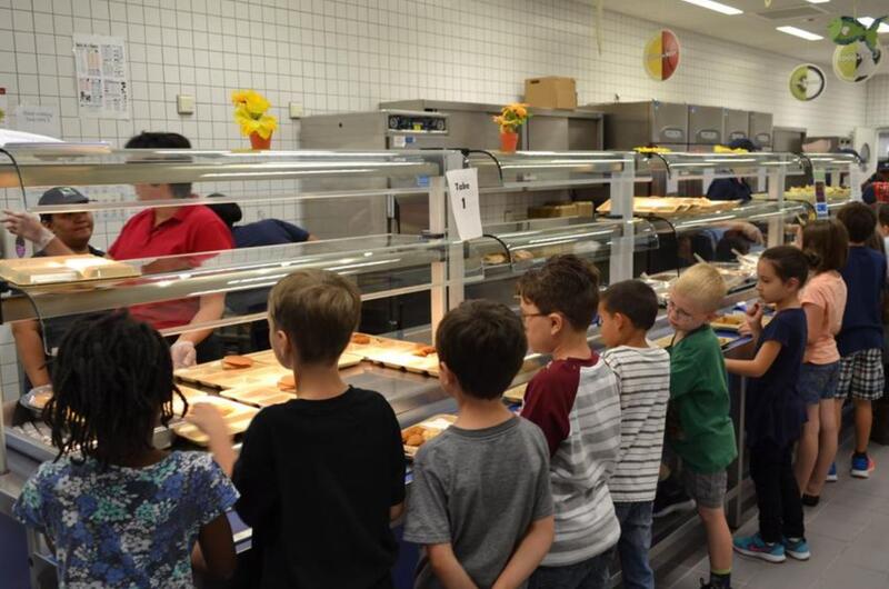 Students line up for lunch at Netzaberg Elementary School, Germany, in 2016. The Department of Defense Education Activity will provide free lunches to all overseas students beginning Nov. 2, 2020.