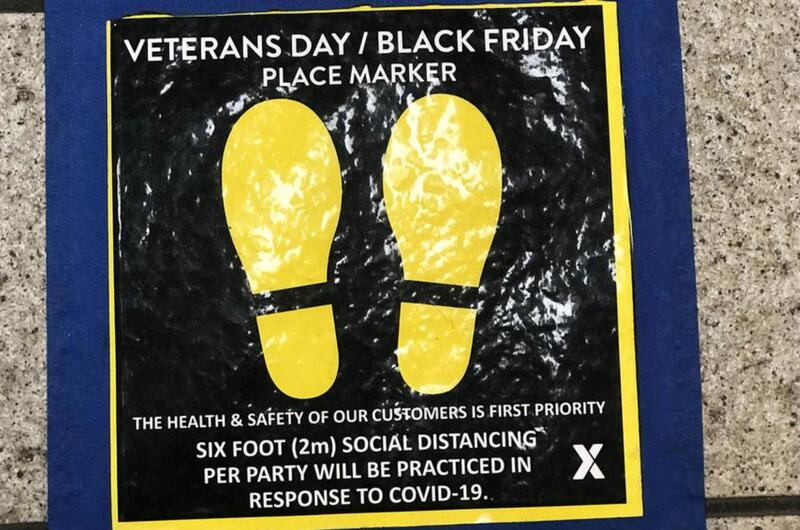 A floor decal reminds exchange patrons at Yokota Air Base in western Tokyo to practice social distancing during Black Friday shopping.