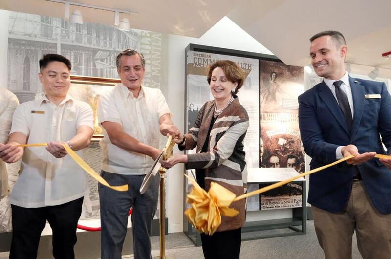 A framed painting by Fernando Amorsolo is on display.