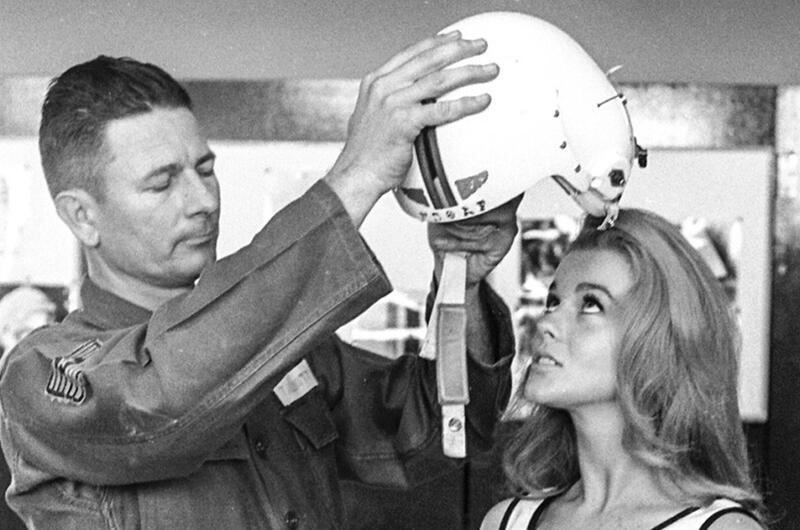Torrejon Air Base, Spain, May, 1964: Actress Ann-Margret, visiting Torrejon Air Base during a break in the filming of "The Pleasure Seekers," doesn't seem to be convinced that putting on a flight helmet is a good idea.