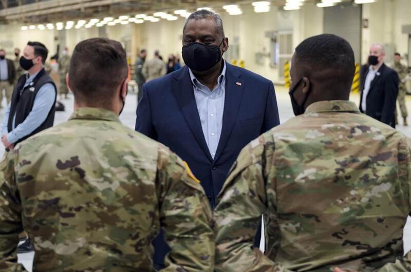 Defense Secretary Lloyd Austin speaks with service members at Osan Air Base, South Korea, Friday, March 19, 2021.