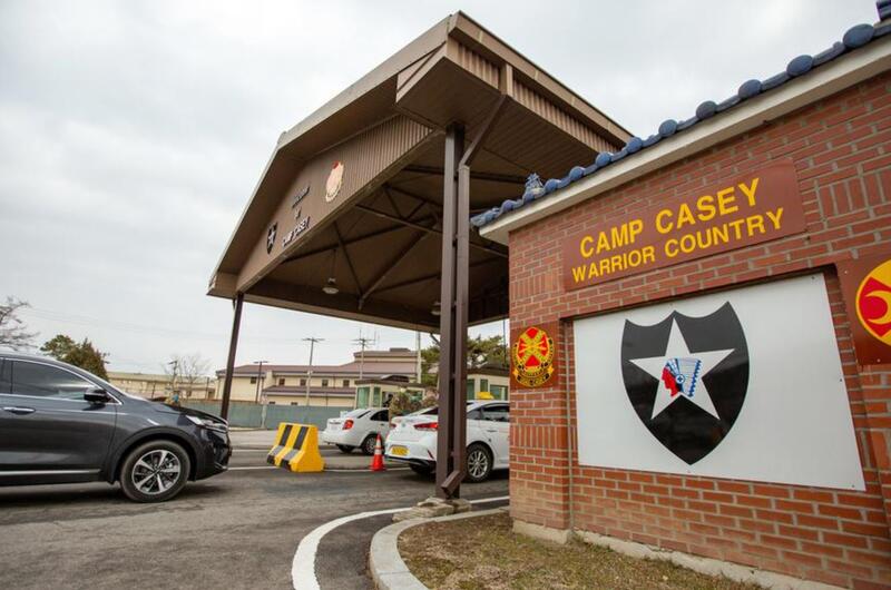 Vehicles line up to enter Camp Casey, South Korea, Feb. 26, 2020.