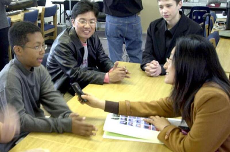 Cho Hyea-ran, a South Korean teacher, interviews pupil and volunteer guide Christopher Campbell, 13, Wednesday at Seoul American Middle School on Yongsan Garrison.