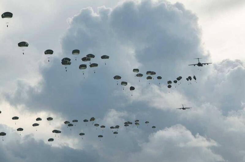 Hundreds of paratroopers assigned to U.S. Army Alaska jump onto Andersen Air Force Base, Guam, Tuesday, June 30, 2020.
