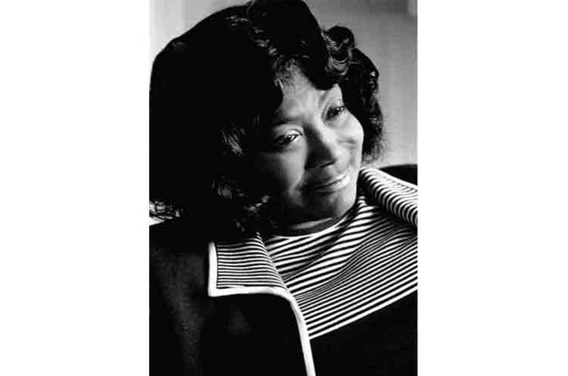 Gospel singer Mahalia Jackson talks to a reporter at her Tokyo hotel.