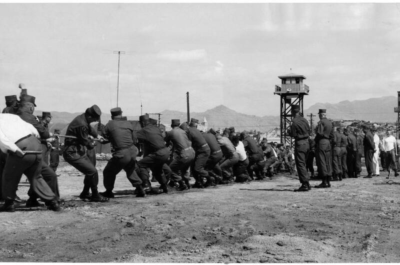 Men compete in a tug of war contest