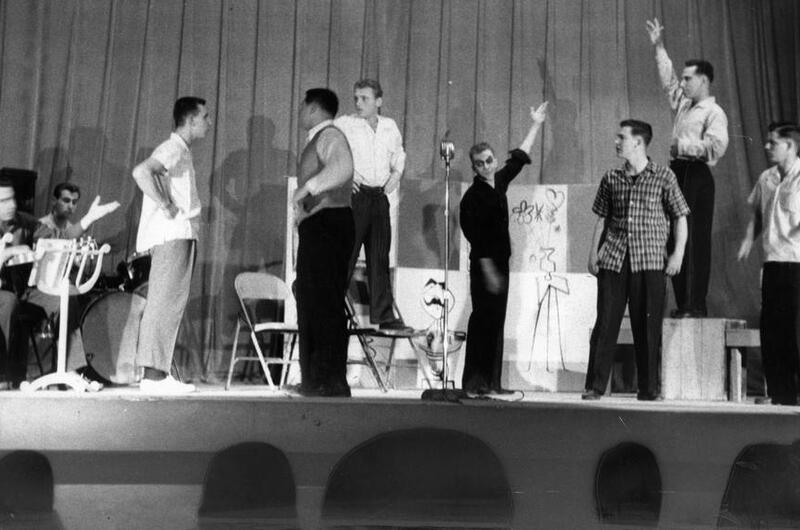 A crew unloads set pieces for the 7th Infantry Division Special Services “soldier show,” to be performed later that day in Seoul, South Korea. After touring various bases and venues throughout Korea in September 1956, the show would move to perform in Japan the next month.