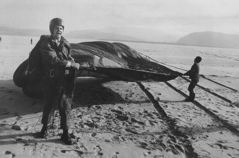 South Korean youth help Spc. David Darwin, 24, recover his parachute near the mouth of the Han River., Dec. 21, 1960. 
