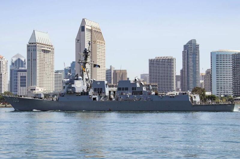 A sailor returns to the guided-missile destroyer USS Kidd at Naval Base San Diego after completing a coronavirus quarantine, June 5, 2020.
