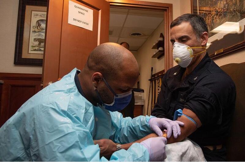 U.S. Navy Capt. Carlos Sardiello, commanding officer of the aircraft carrier USS Theodore Roosevelt (CVN 71), gives blood for a serology study aimed at identifying antibodies associated with COVID-19 aboard the ship on April 22, 2020.