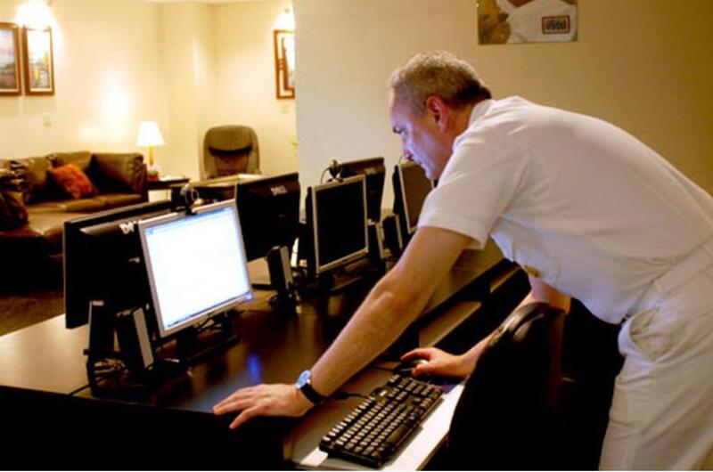 Kitty Hawk Strike Group Command Master Chief Terry Etherton checks his e-mail Friday at Yokosuka&#39;s new USO. The 2,000-square-foot center has free Wi-Fi and computers for active-duty military and their families.