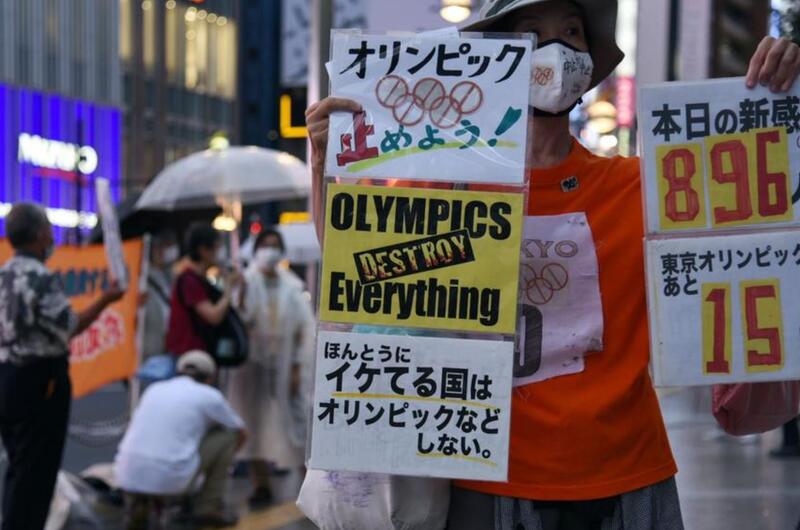 Anti-Olympics protestors hold a demonstration in central Tokyo, Thursday, July 8, 2021, the same day Japan's prime minister announced a fourth coronavirus state of emergency for the capital.