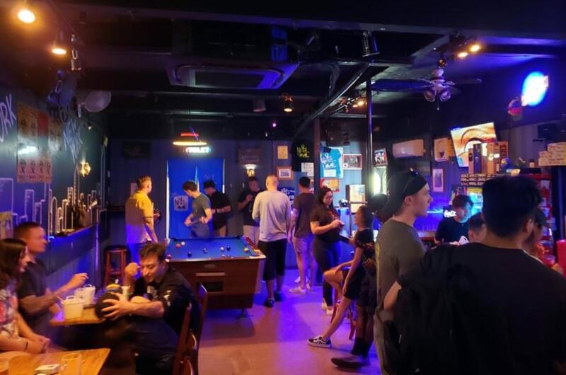 U.S. service members and others hang out at the New York New York Bar and Grill near Yokosuka Naval Base, Japan, Tuesday, June 22, 2021. 