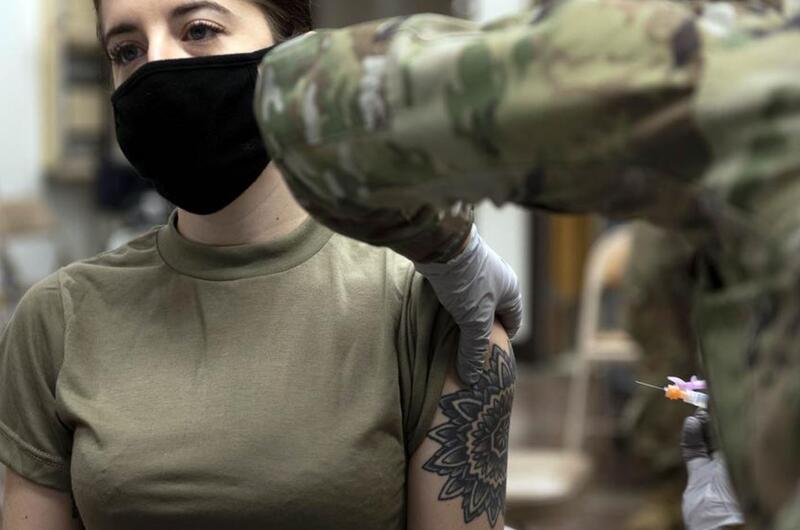 Senior Airman Kassidy Peters receives her first dose of the Moderna COVID-19 vaccine at Osan Air Base, South Korea, Dec. 29, 2020.