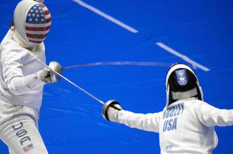 A U.S. women’s Olympic fencing team cadet athlete, Amanda Pirkowski, left, spars with Olympian Kelley Hurley inside Lotus Culture Center Arena at the Atago Sports Complex in Iwakuni, Japan, July 16, 2021.