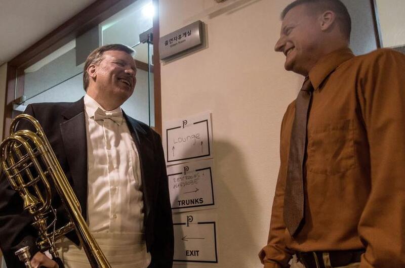 Blair Bollinger, left, a trombonist for the Philadelphia Orchestra, greets Staff Sgt. James Beeson, a trombonist for the 8th Army Band, backstage at the Seoul Arts Center's Music Hall, Thursday, June 8, 2017.