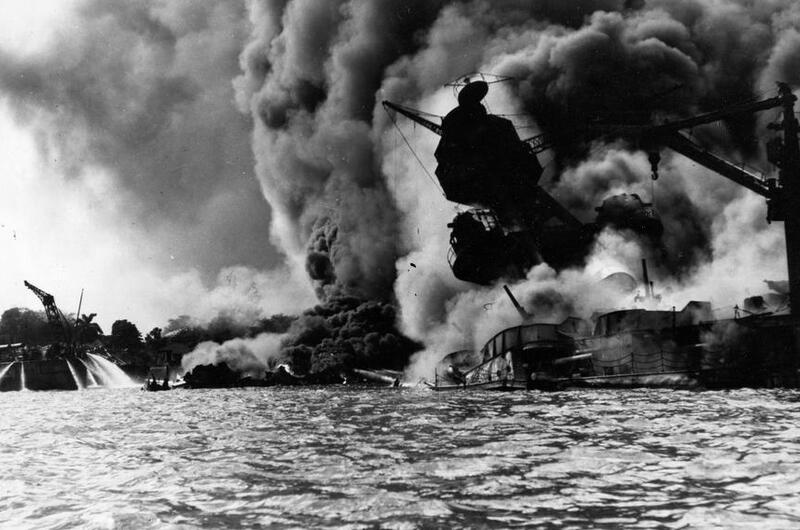 The USS Arizona burns after being struck by Japanese bombs