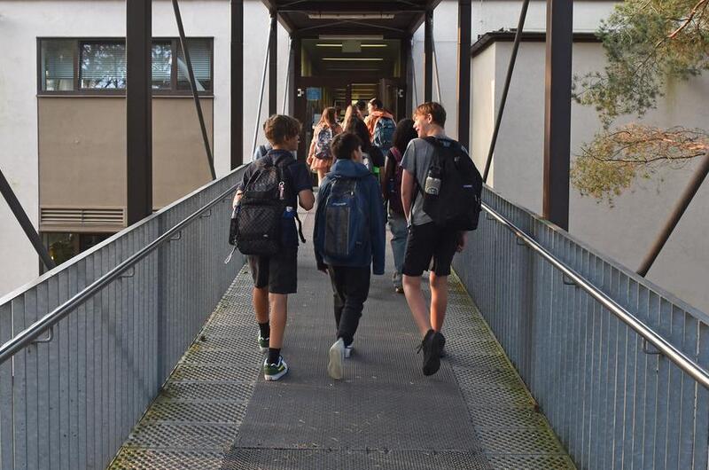 Students going to class on a walkway.