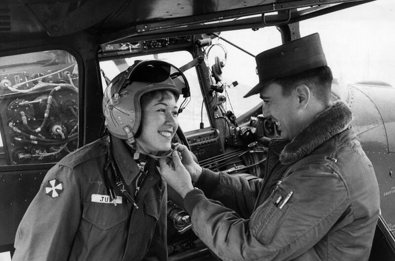 A woman tries on a helmet