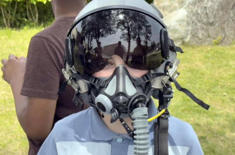 An Osan Elementary School student poses in fighter pilot gear on Career Day at Osan Air Base, South Korea, May 9, 2025.