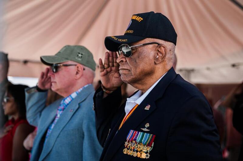 James Capers salutes during a ceremony.