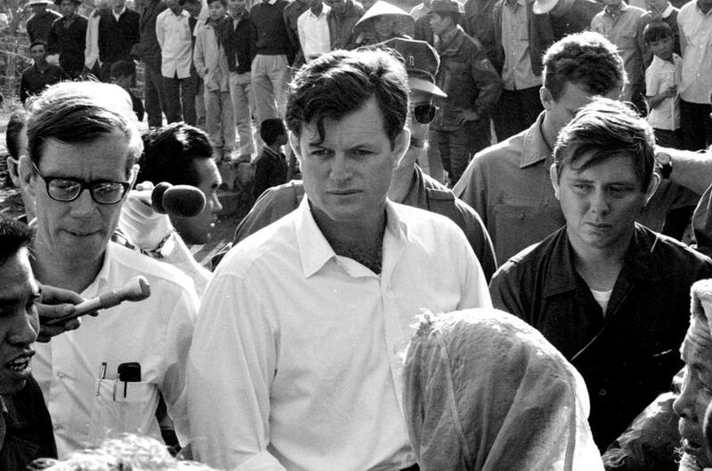 Edward M. Kennedy (D-Mass.) talks with refugees.