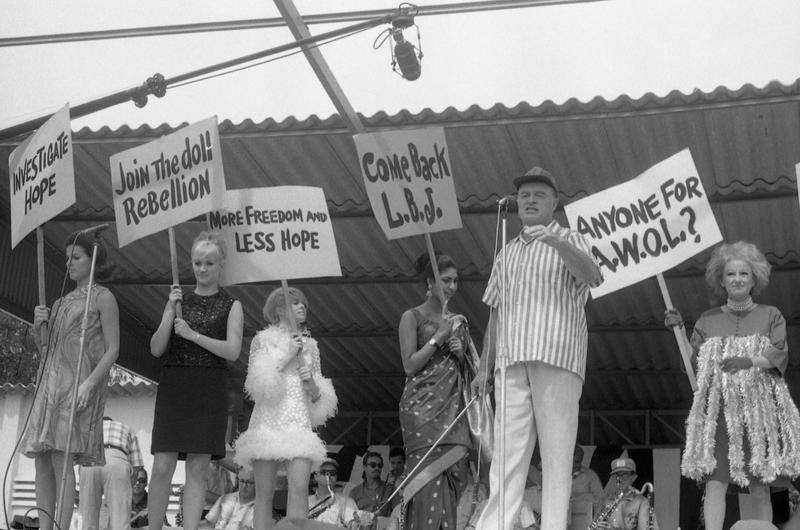 Female members of troupe protest treatment by Bob Hope in joke routine.