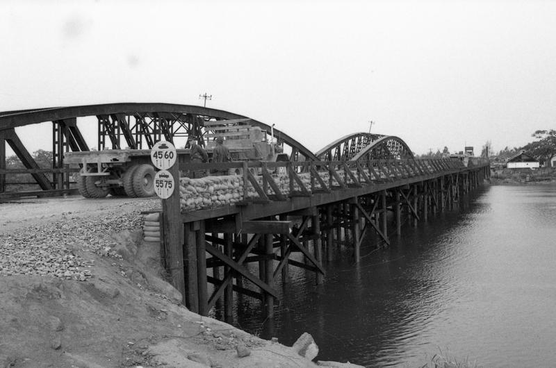 Typical Seabeem road building and bridge projects on Route 1 between Phu Loc and Hue, the old capital.; Trucks pass a Seabee-built bridge on Route.
