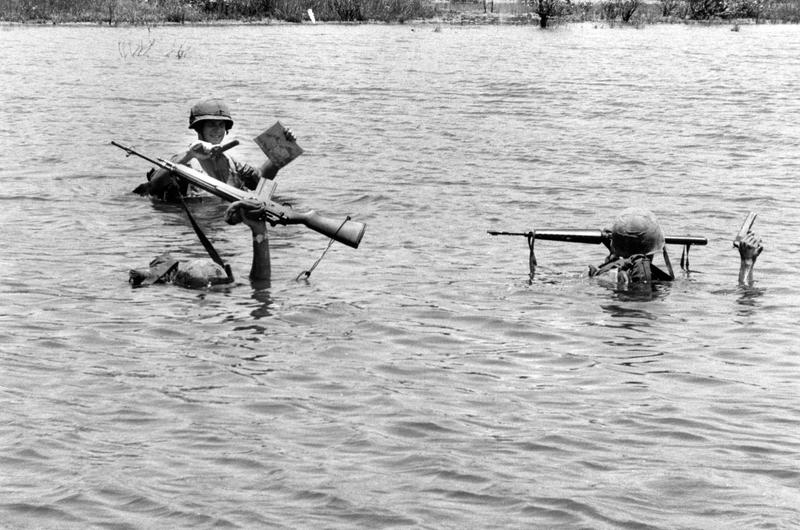 Leatherneck stands tall while crossing river during Operation Beacon Guide north of Da Nang.