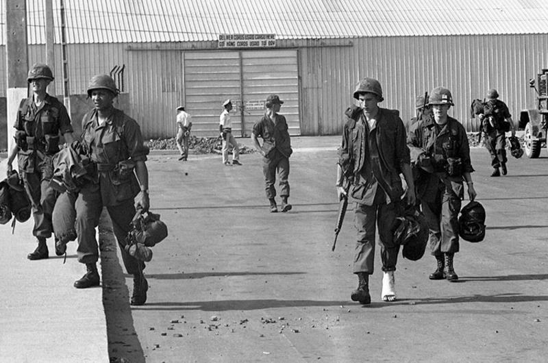 Sp5 Heinz Huder of Palm Bay, Florida - his right foot in a cast - walks at an unidentified airport in South Vietnam.