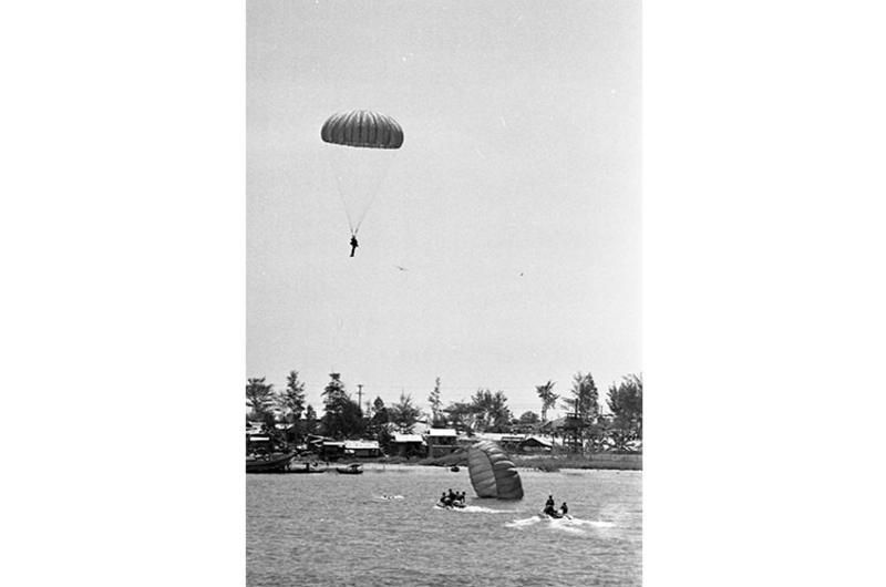 Army of the Republic of Vietnam (ARVN) paratroopers and sky divers land on Da Nang river.