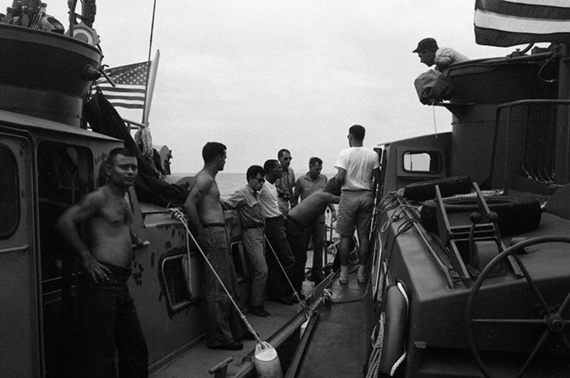 Two swift boats meet and exchange information. 