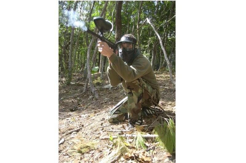 A Marine launching a volley of paintball shots