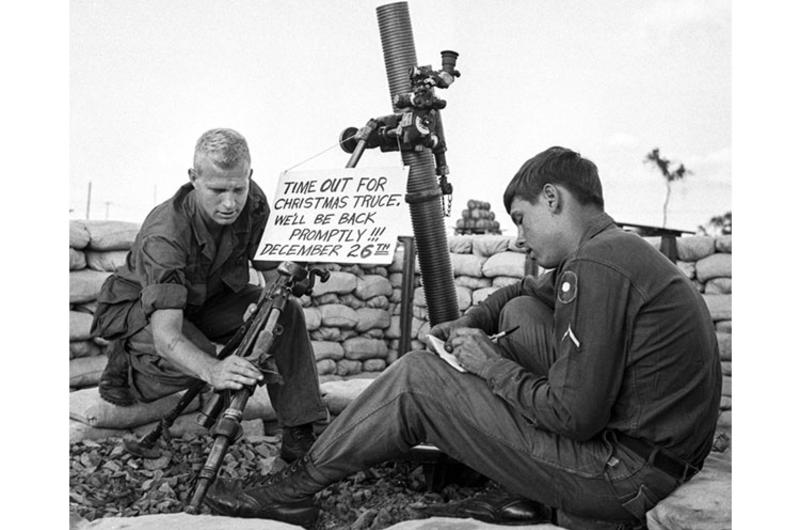 9th Infantry Division soldiers Staff Sgt. William Dowell of Orange Lake, N.J., and Pfc. Ronald Hull of Waupun, Wis., hope for the best as they relax next to an idle mortar.