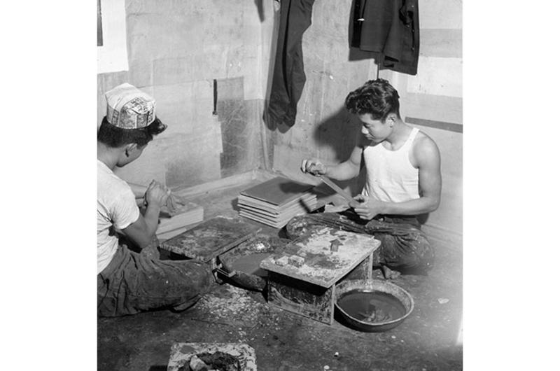 Standing Wood and applying a special plaster, these older orphans of the Seoul Police and Soliders Orphanage are learning lacquerware manufacture, a centuries-old profession for which there is still a ready market today.