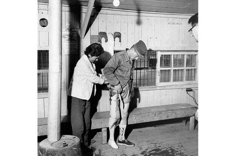 NEW ARTIFICIAL LEG is fitted to a disabled veteran of the Korean war by Dr. Chung Hie Oh at the National Rehabilitation Center in Pusan.