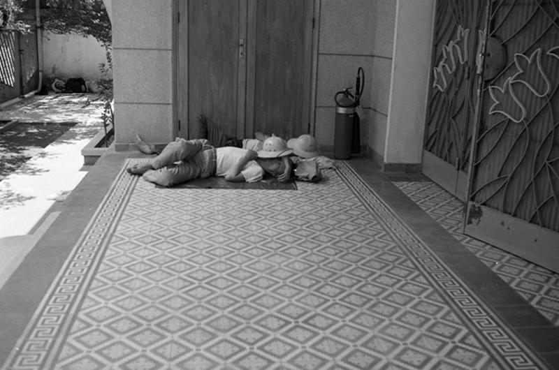 Unidentified Vietnamese find a spot to catch some zzzz's. Exact location unknown.