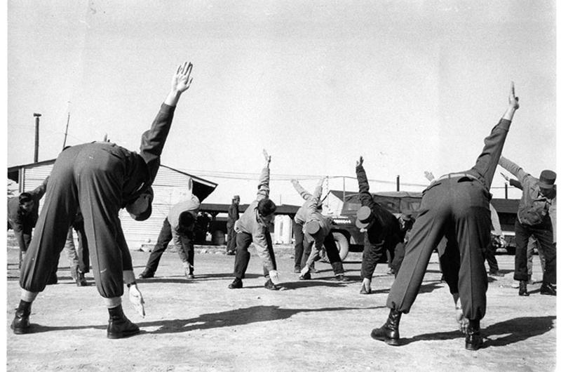 RECONDITIONING EXERCISES are led by SP5 Wallace C. Henninger, chief ward master, and SFC Harold Kelleher, training NCO.