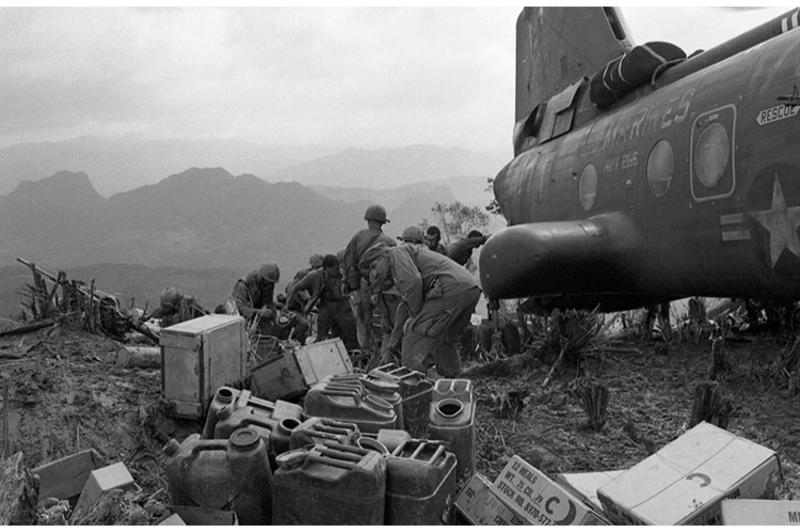 A Marine helicopter lands on the hill landing zone (LZ) to bring supplies and evacuate the wounded.