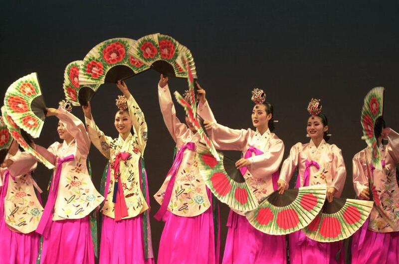 Korean women dancing fun dance.