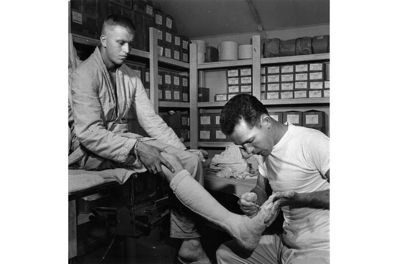 Spc. Paul W. Sebesky prepares a leg cast at the 121st Evacuation Hospital.