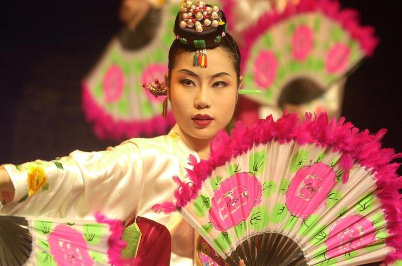 A Korean woman performs a traditional dance