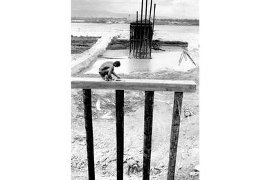 A Seabee from Naval Mobile Construction Battalion 4 works on the “Liberty Bridge”.
