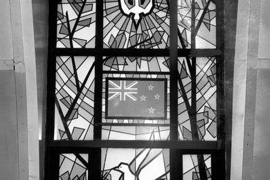One of the 12 colored windows now in the South Post Chapel at Yongsan shows the dove of peace and the national flag of New Zealand.