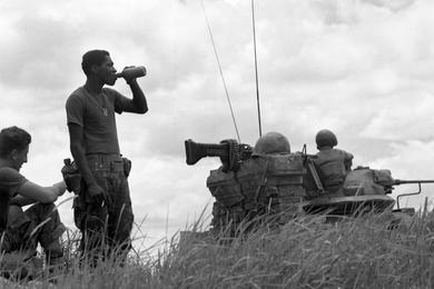 Members of the 2nd Battalion, 1st Regiment, 1st Marine Division take a break during sweep operations on the north side of Go Noi Island.
