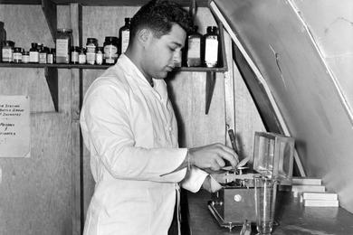 Medical compound is mixed by SP4 Carl J. Bellelo, pharmacist with the 17th Inf. aid station. Although medical facilities of aid station are extensive, the unit is ready to evacuate on a moment's notice.