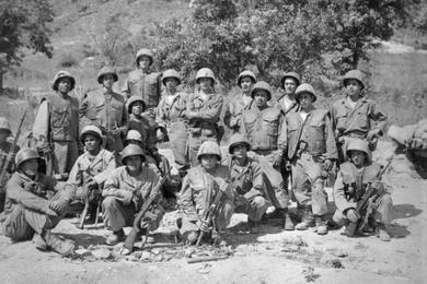 The raiders line up for a pre-assault picture. A little later, Lieutenant Bernal (center with arms folded) led the savage attack against the enemy hillock.